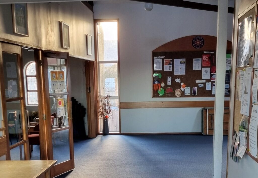 Carpeted lounge areas and doors opening into the church. Available for room hire.
