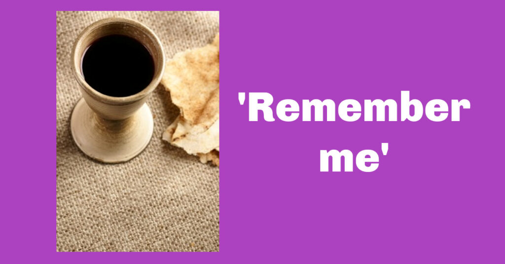 Image shows a purple background; a pottery cup of wine and some bread. The words: 'Remember me.'