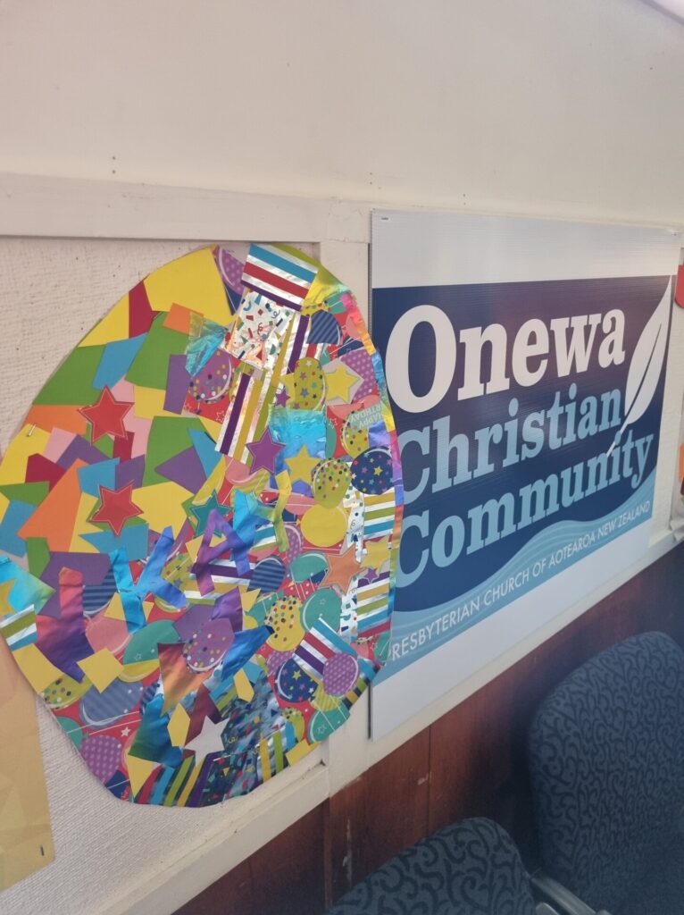 Foil easter egg poster and Onewa Christian Community sign.