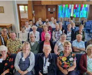 Photo of the congregation of Onewa Christian Community who are smiling at the camera